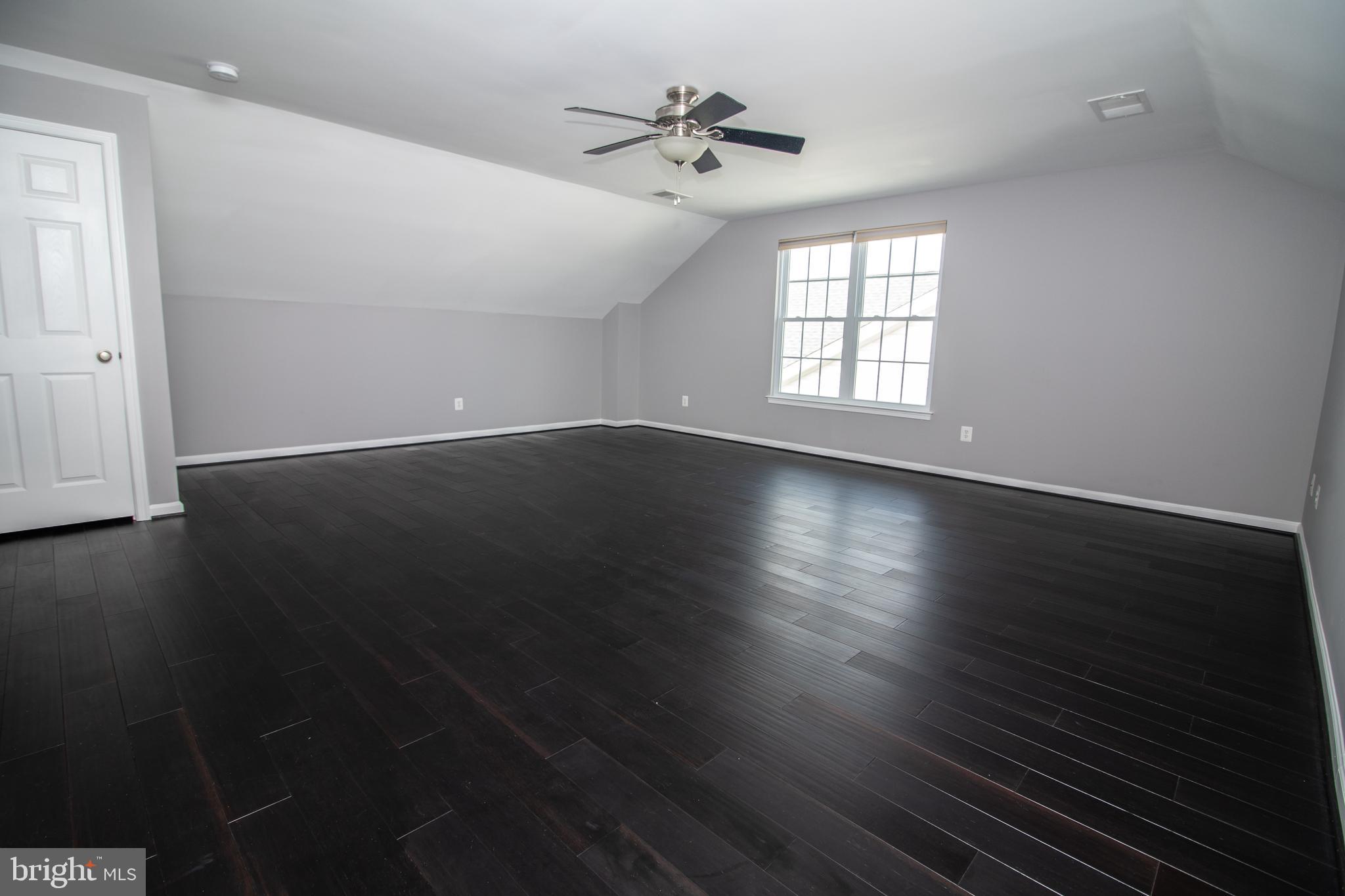 25257 Doolittle Lane Chantilly, VA 20152 - Photo 41 of 52 an empty room with wooden floor and windows