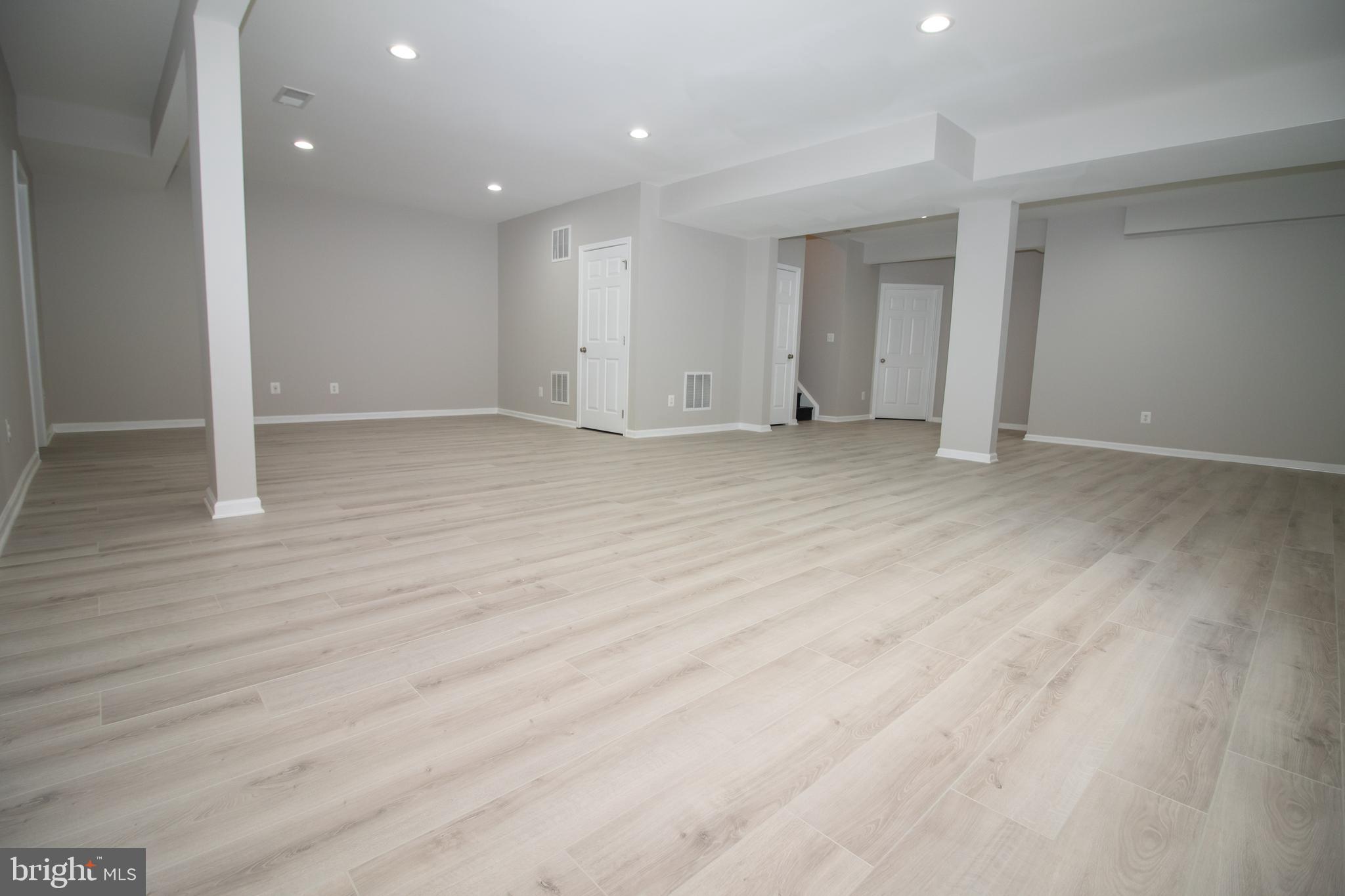 25257 Doolittle Lane Chantilly, VA 20152 - Photo 47 of 52 an empty room with wooden floor and windows