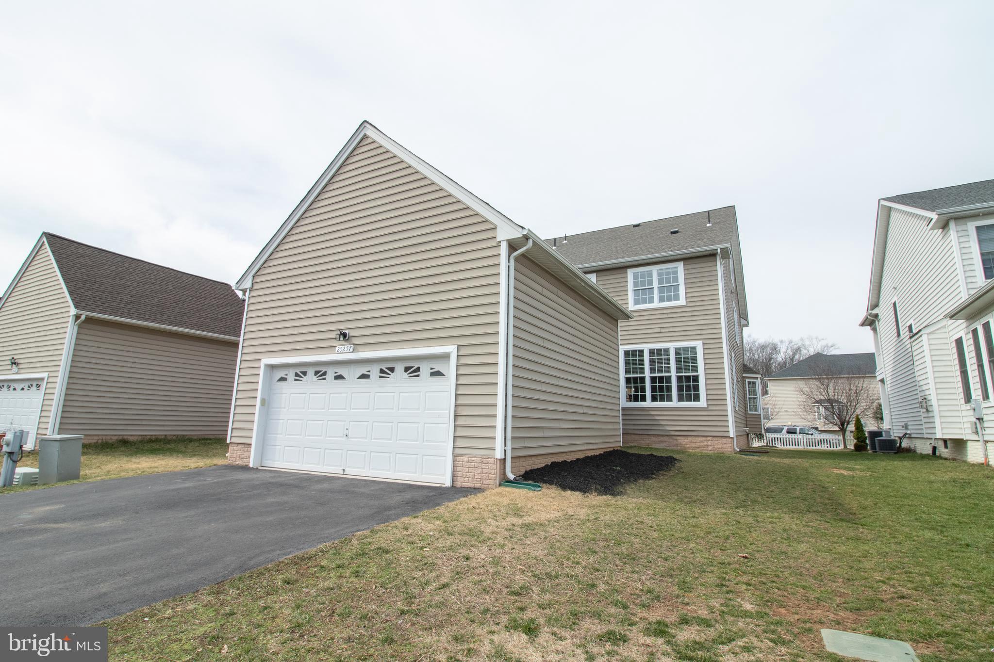 25257 Doolittle Lane Chantilly, VA 20152 - Photo 50 of 52 a view of a house with a yard
