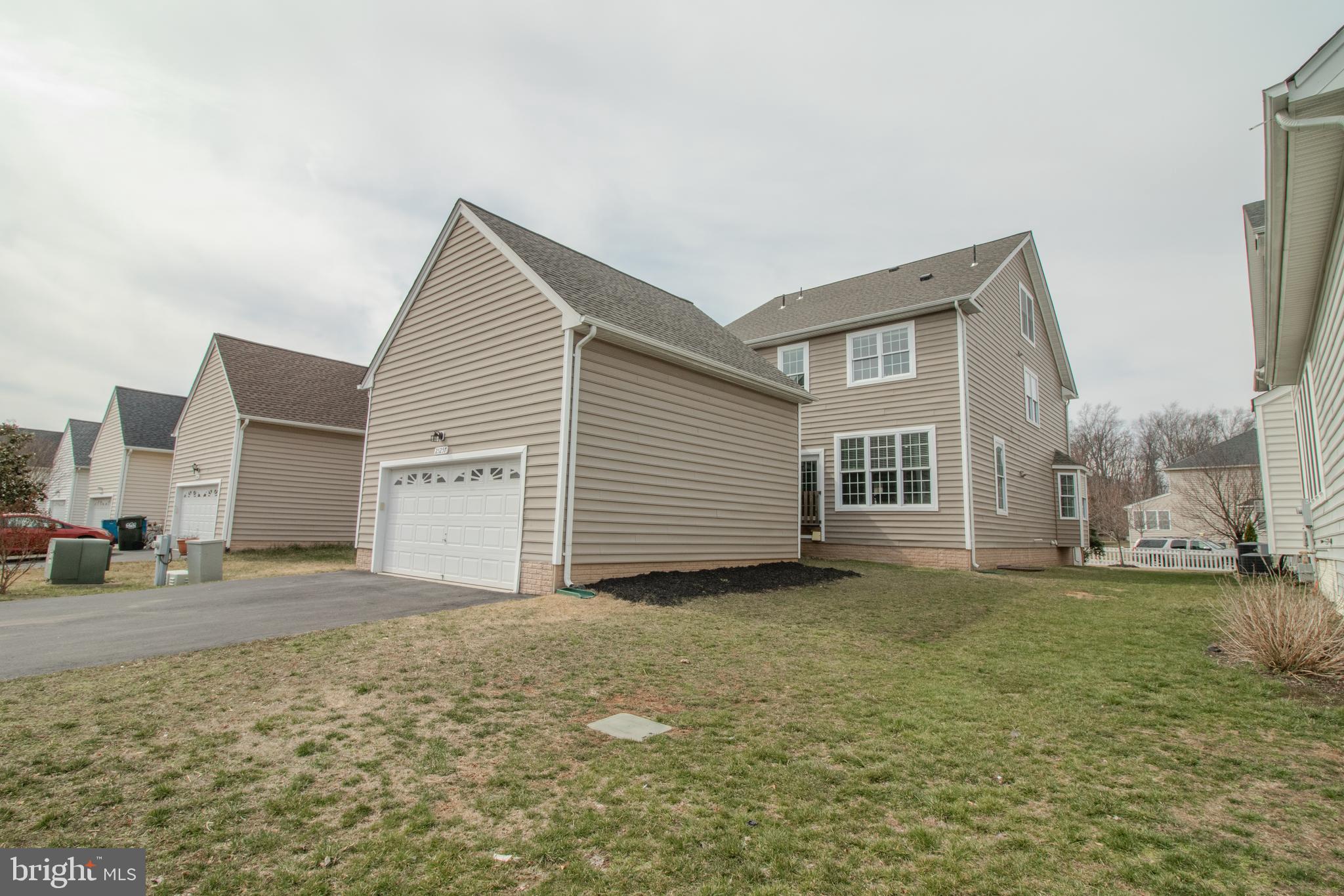 25257 Doolittle Lane Chantilly, VA 20152 - Photo 51 of 52 a view of a house with a yard and garage