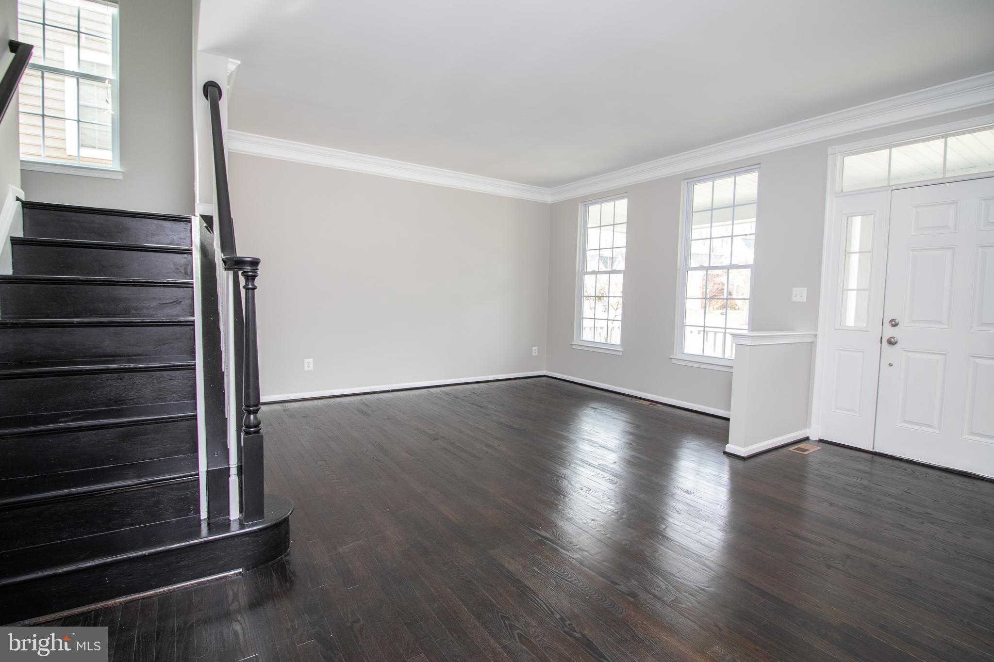 25257 Doolittle Lane Chantilly, VA 20152 - Photo 6 of 52 an empty room with wooden floor and windows
