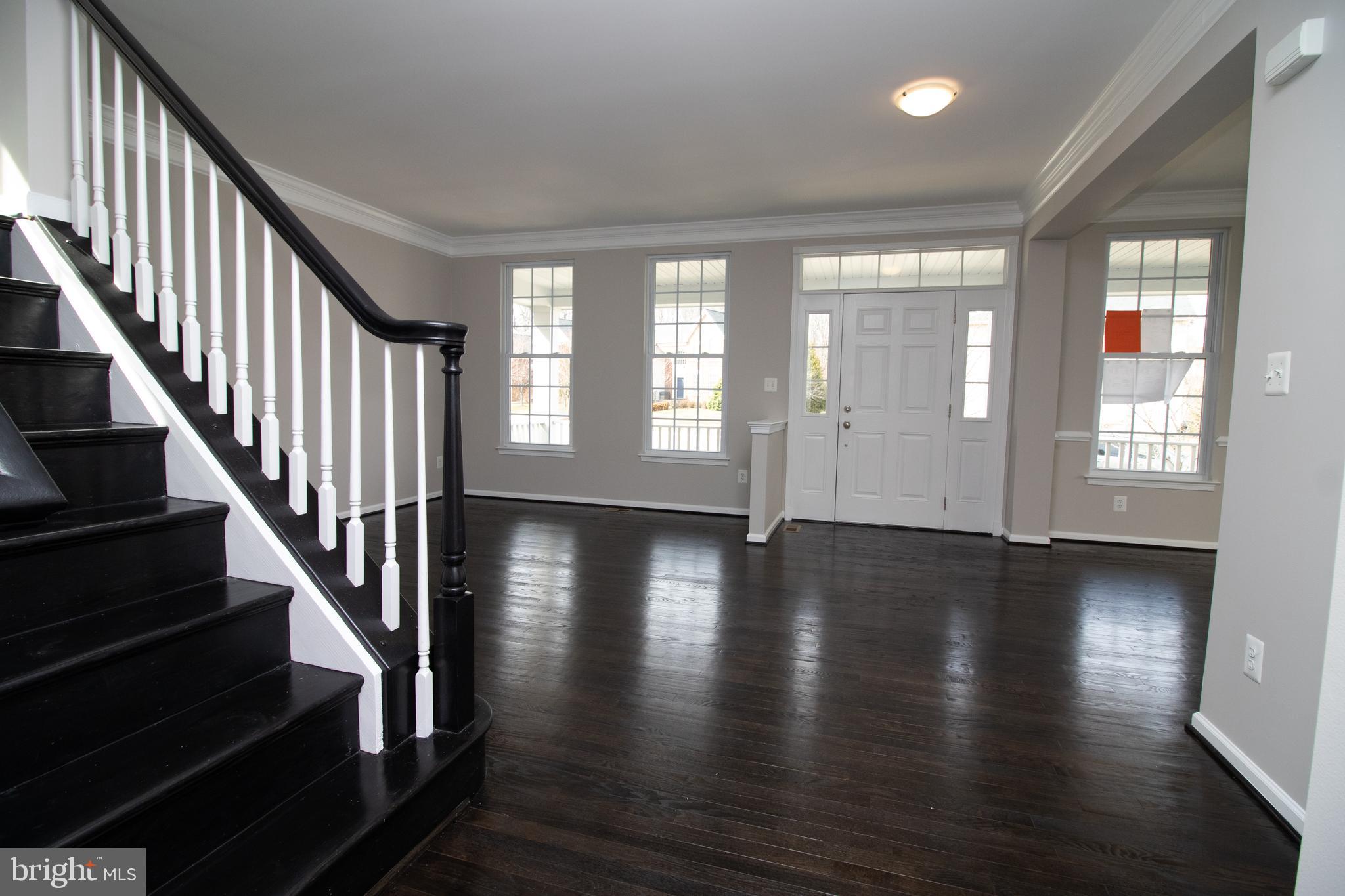 25257 Doolittle Lane Chantilly, VA 20152 - Photo 9 of 52 an empty room with wooden floor and windows