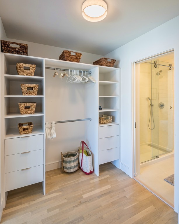 31 Constitution Way, Unit 31 Marblehead, MA 01945 - Photo 17 of 30 a view of walk in closet with clothes and shoes
