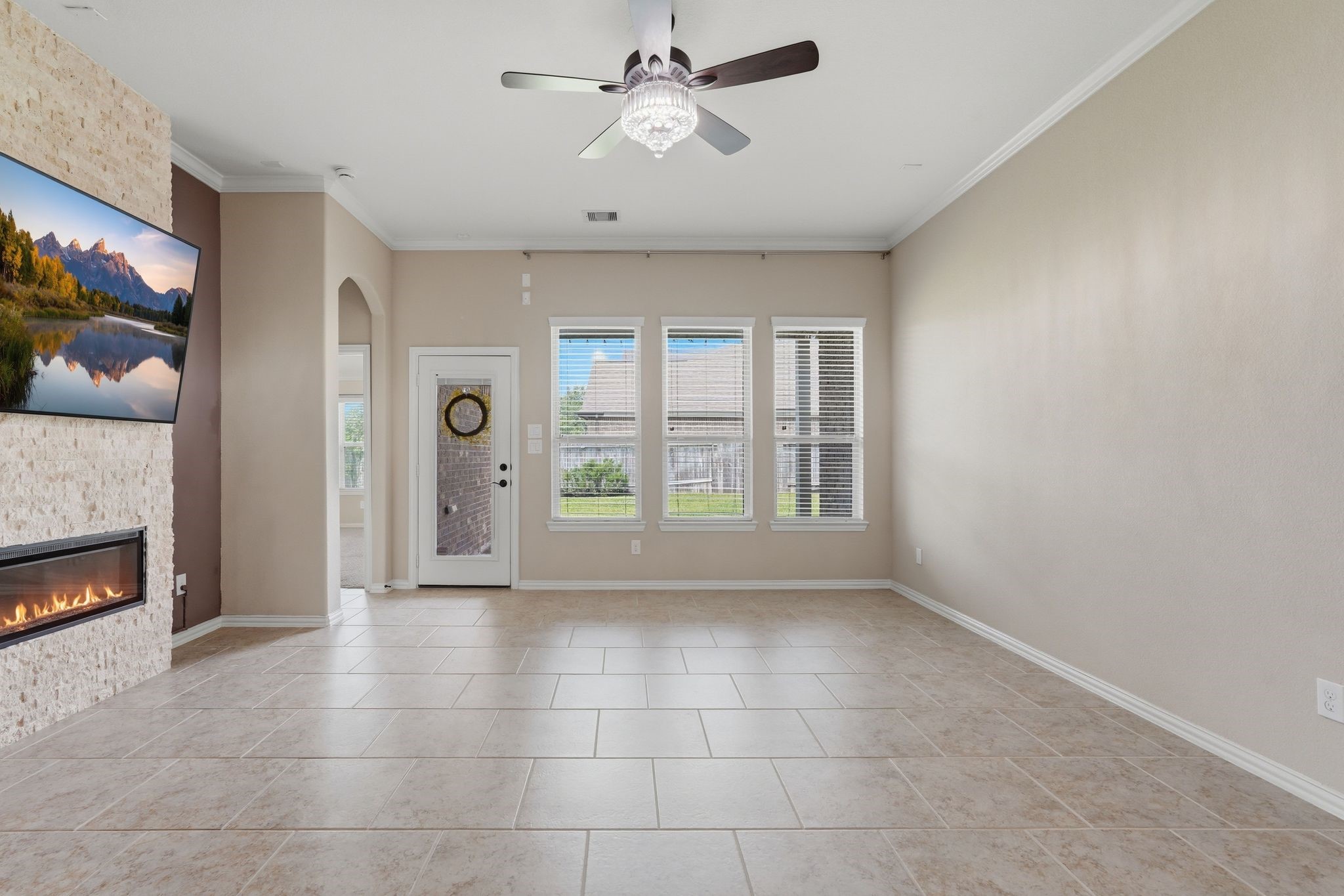 18227 Tacoma Ridge Drive Tomball, TX 77377 - Photo 19 of 45 Light-filled gathering space with backyard views and a beautiful fireplace centerpiece.