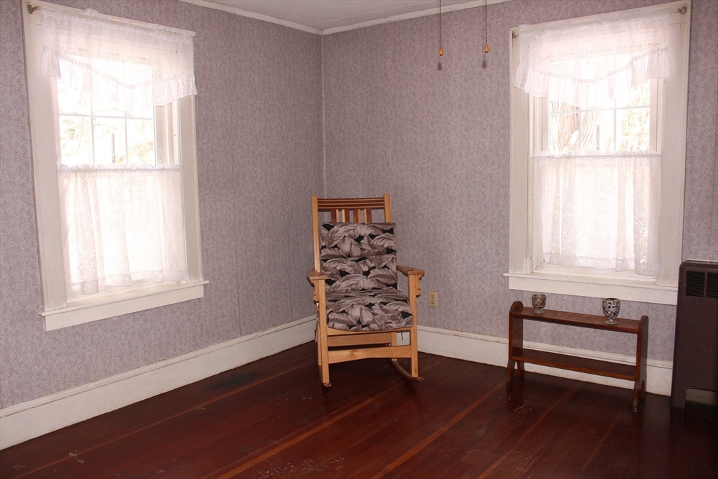 89 Columbus Avenue Greenfield, MA 01301 - Photo 16 of 20 a view of a livingroom with wooden floor and a window