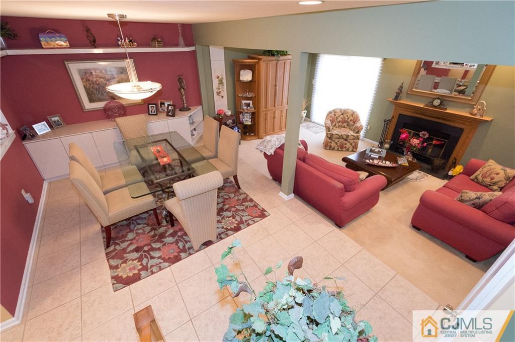 2403 Timber Oaks Road Edison, NJ 08820 - Photo 2 of 25 a living room with furniture and a fireplace