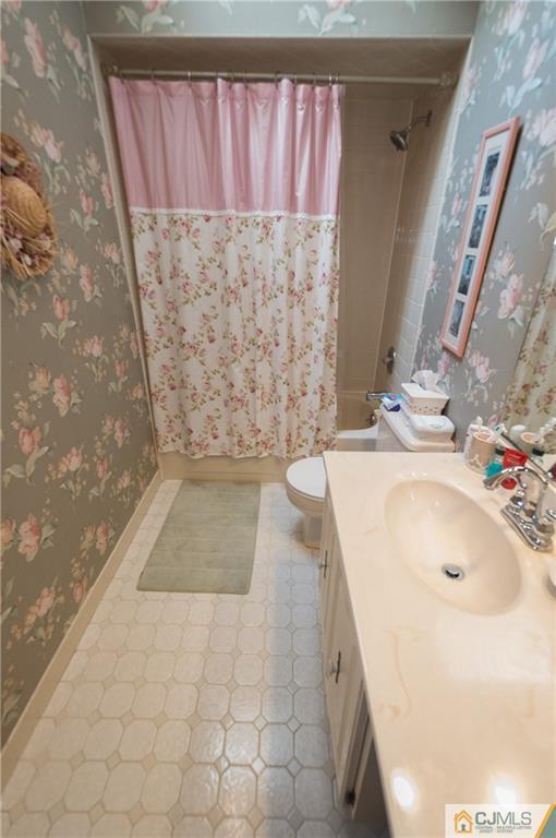 2403 Timber Oaks Road Edison, NJ 08820 - Photo 16 of 25 a bathroom with a sink a toilet and shower