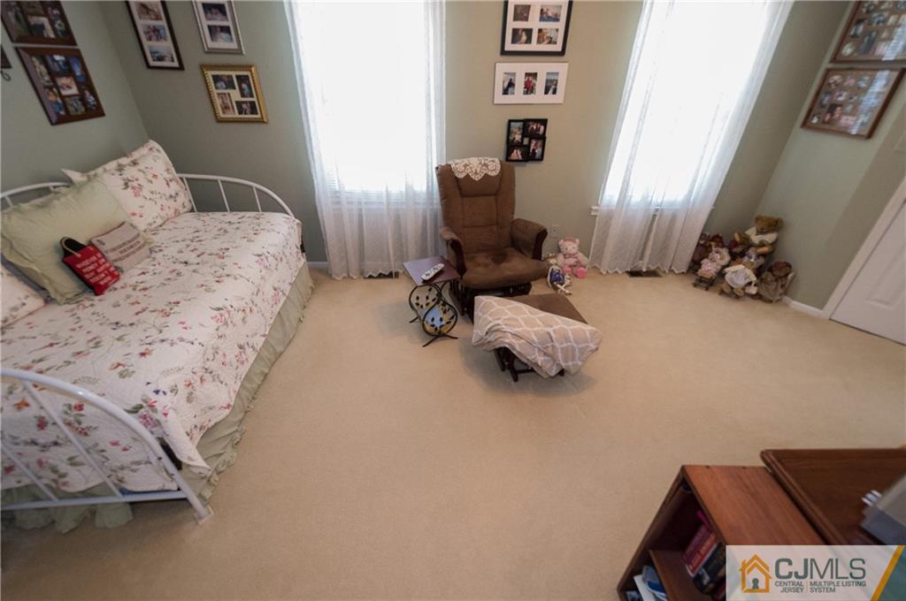 2403 Timber Oaks Road Edison, NJ 08820 - Photo 18 of 25 a bedroom with a bed and furniture