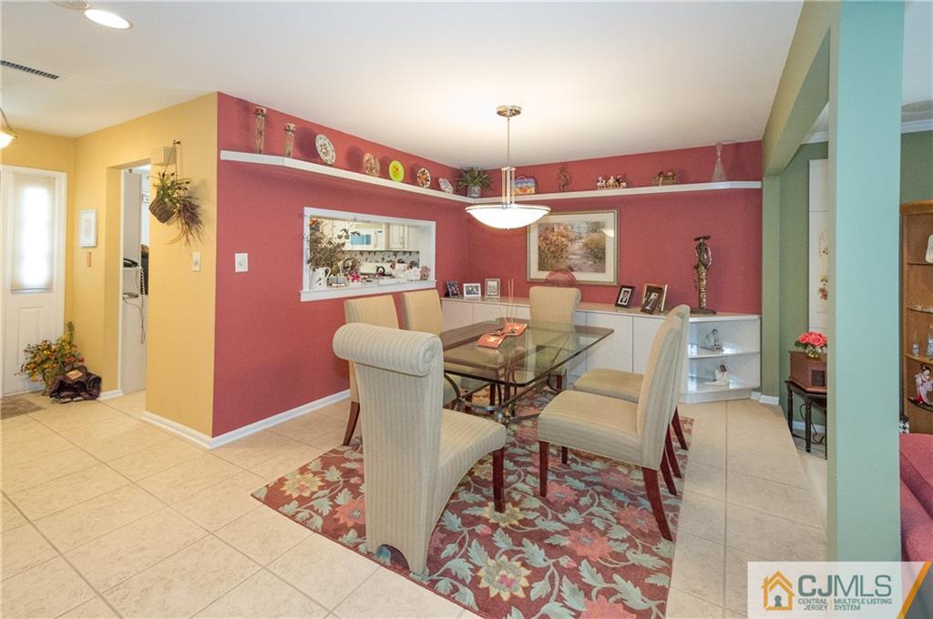 2403 Timber Oaks Road Edison, NJ 08820 - Photo 3 of 25 a living room with furniture and a rug