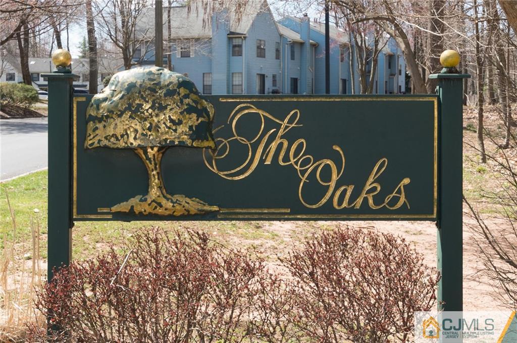 2403 Timber Oaks Road Edison, NJ 08820 - Photo 25 of 25 a street sign on a pole next to a building