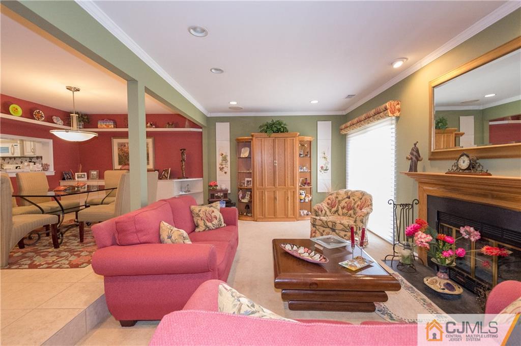 2403 Timber Oaks Road Edison, NJ 08820 - Photo 7 of 25 a living room with furniture and a fireplace