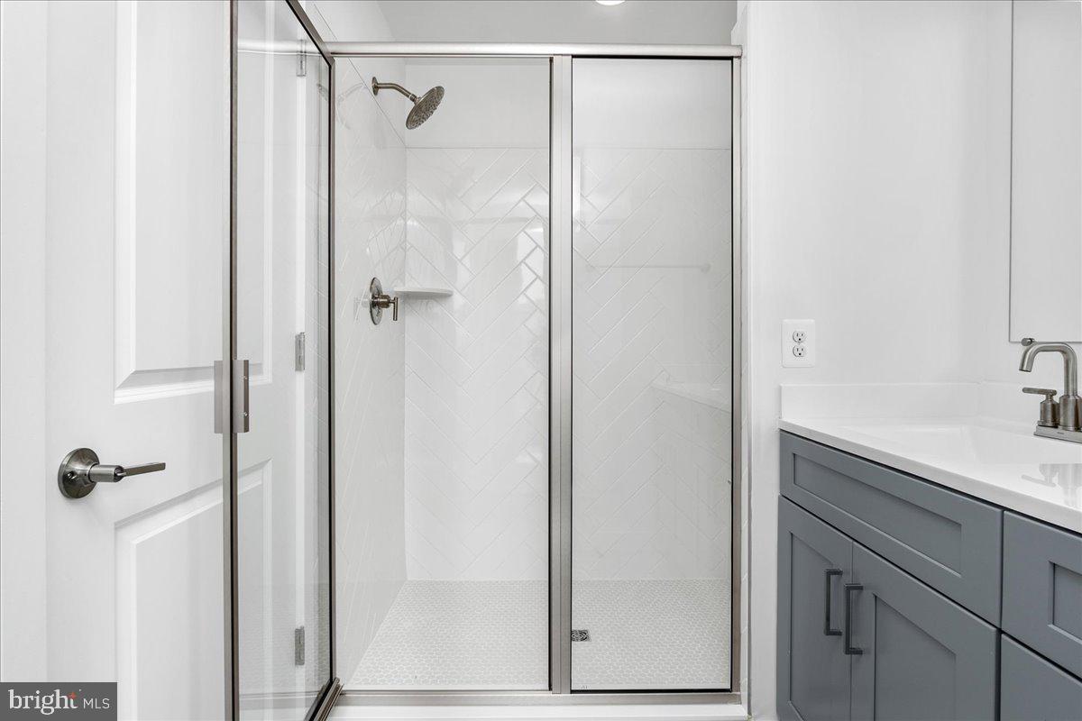 711 Iron Frg Road, Unit A Frederick, MD 21702 - Photo 15 of 18 a bathroom with a shower and a sink