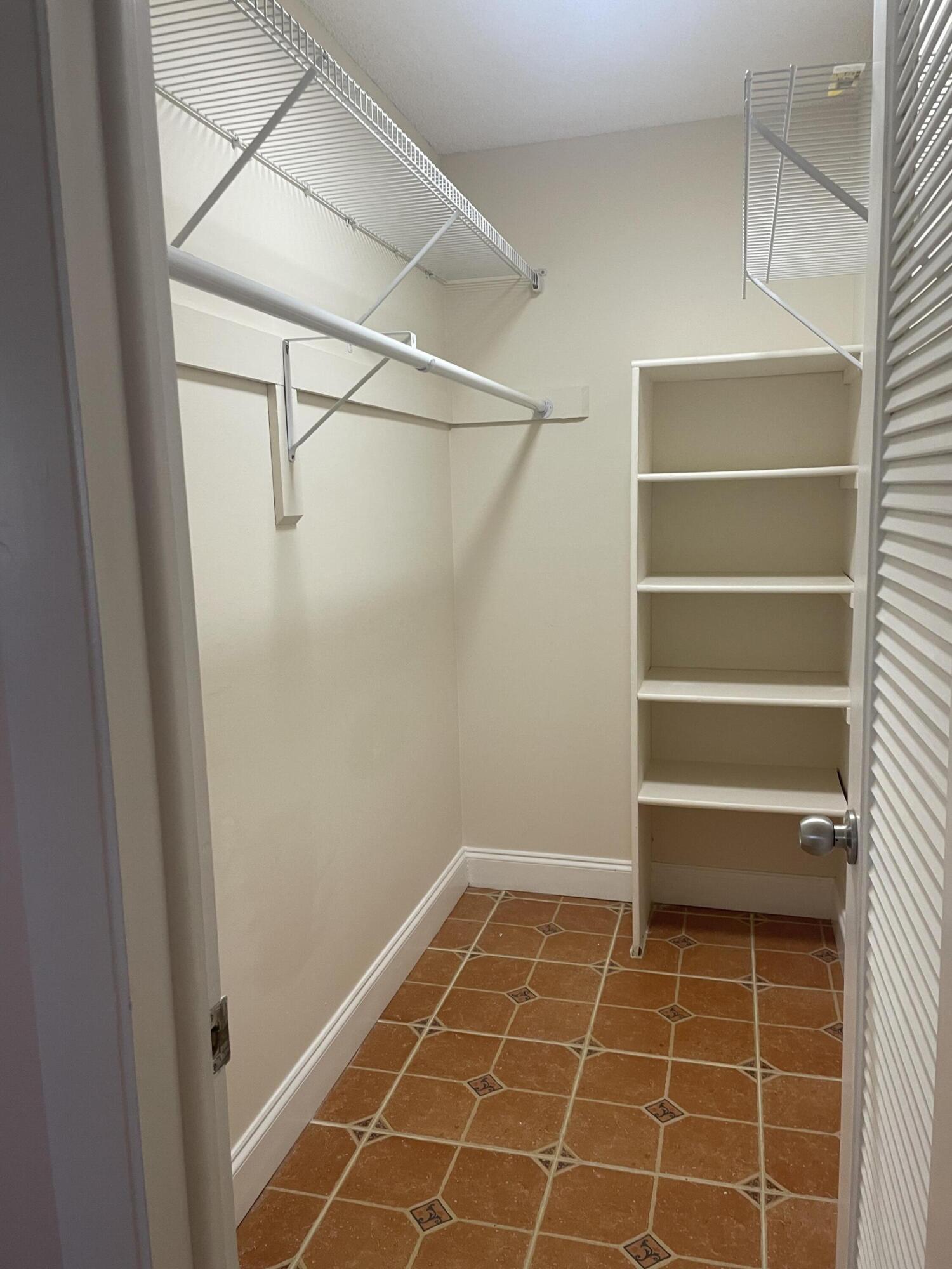 402 Monaco Way, Unit I Delray Beach, FL 33446 - Photo 14 of 25 a view of an empty walk in closet