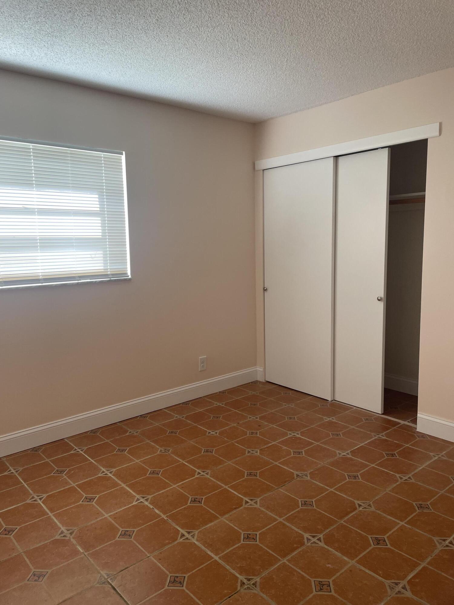 402 Monaco Way, Unit I Delray Beach, FL 33446 - Photo 21 of 25 a view of an empty room