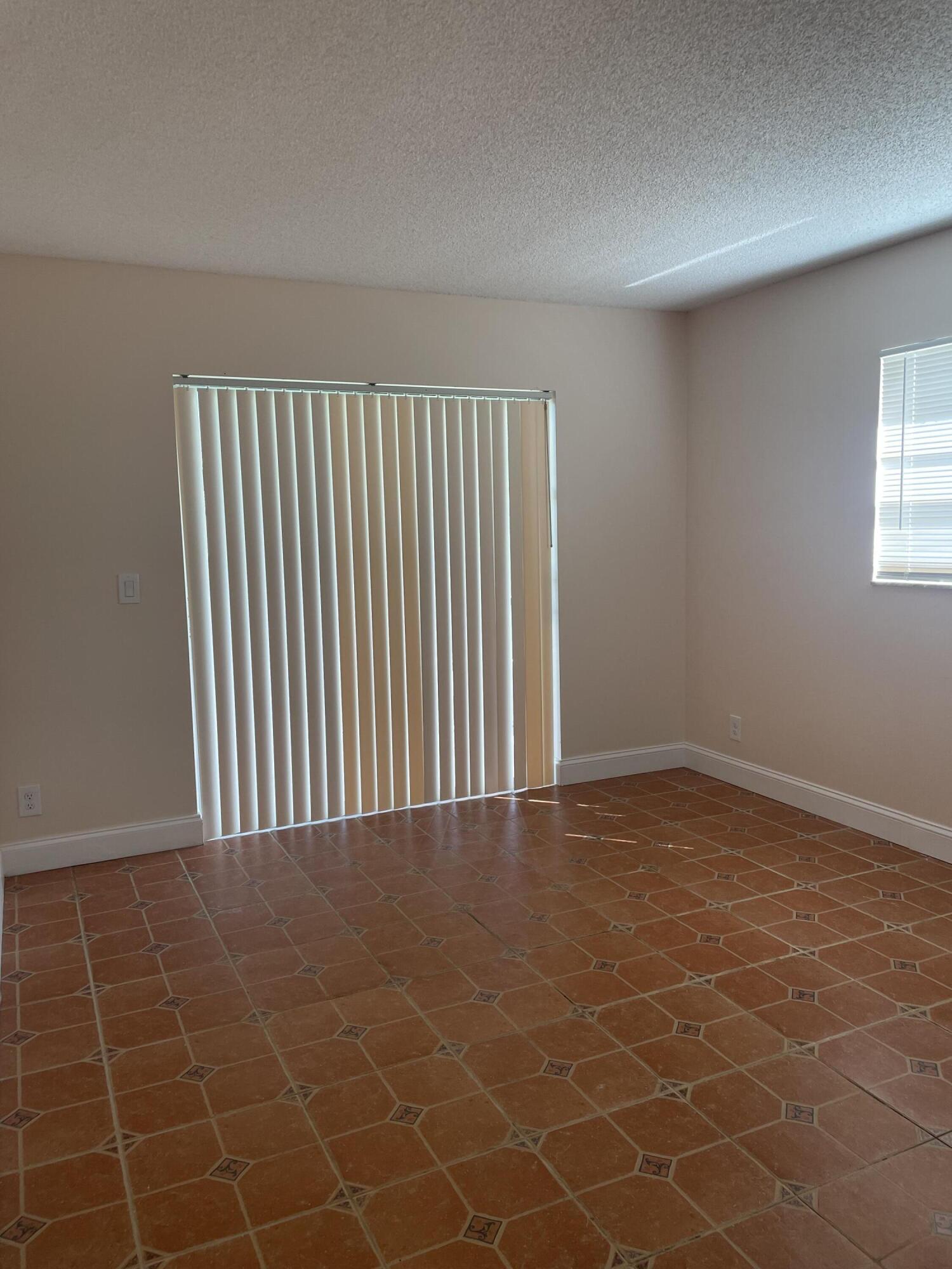 402 Monaco Way, Unit I Delray Beach, FL 33446 - Photo 22 of 25 a view of an empty room with a window