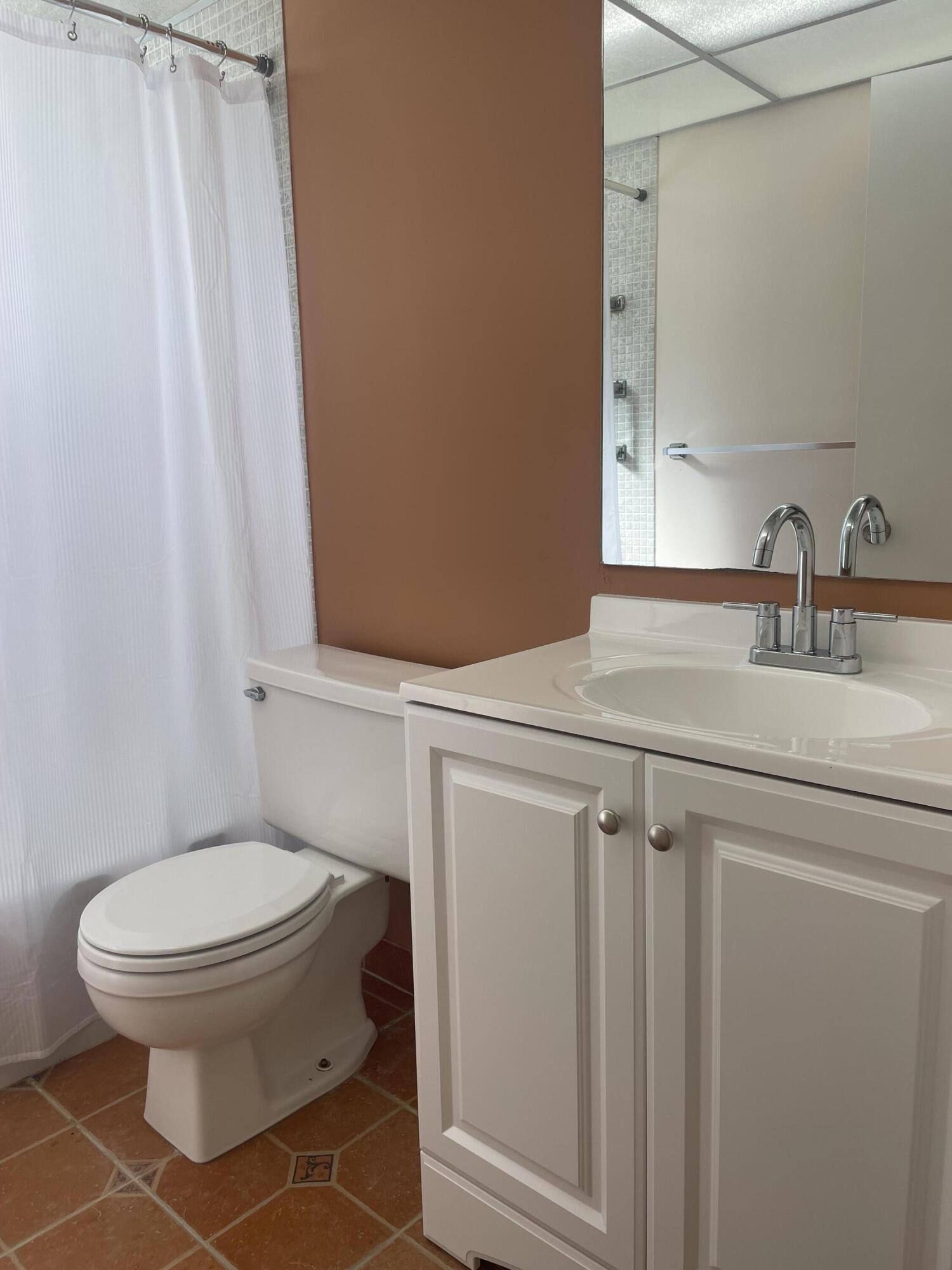 402 Monaco Way, Unit I Delray Beach, FL 33446 - Photo 10 of 25 a bathroom with a toilet and a sink