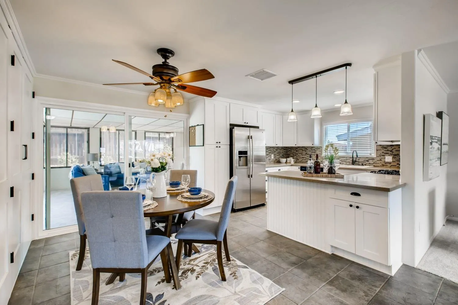 13639 Utopia Road Poway, CA 92064 - Photo 11 of 25 a dining room with furniture a chandelier and wooden floor