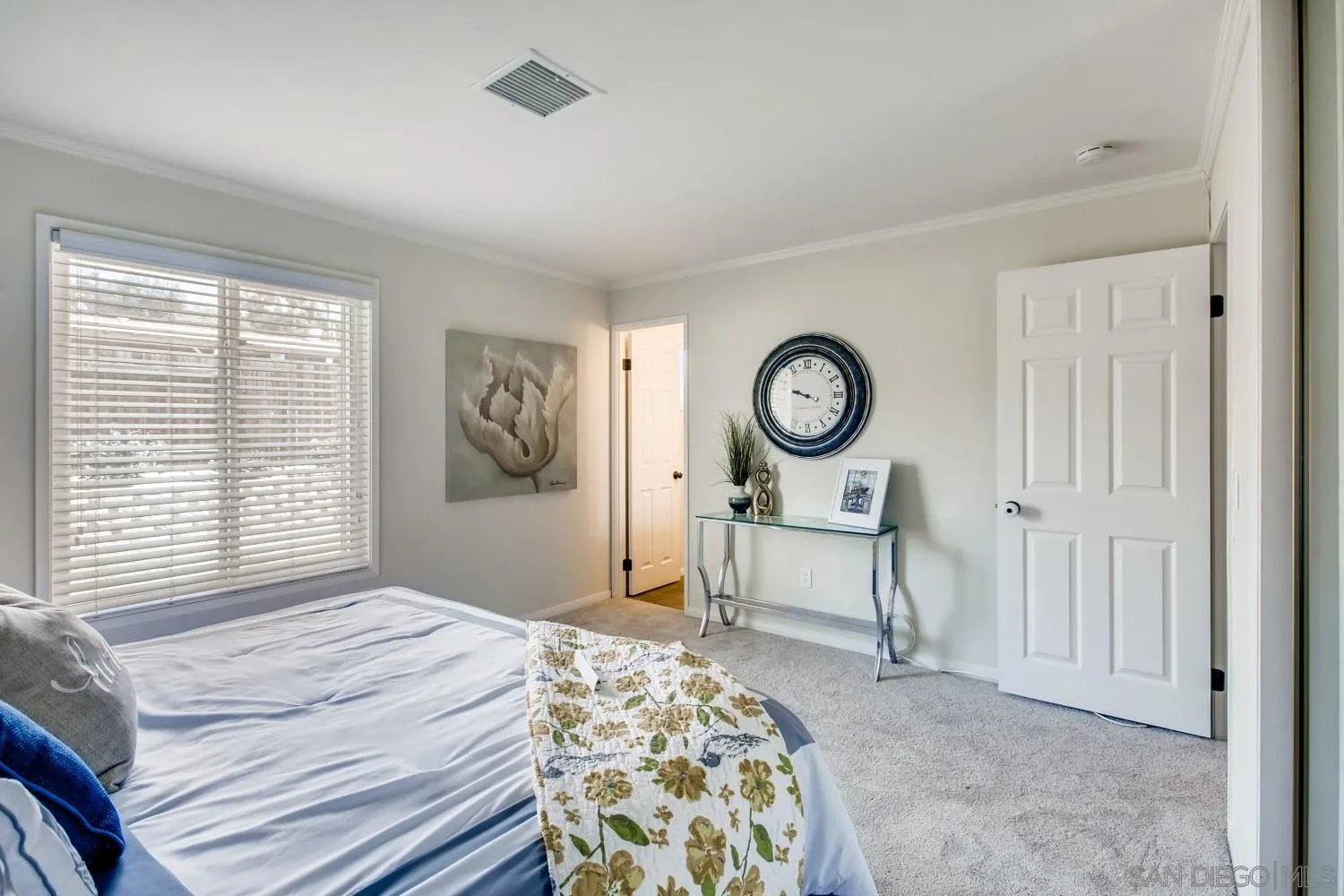 13639 Utopia Road Poway, CA 92064 - Photo 14 of 25 a bedroom with a bed and a chandelier