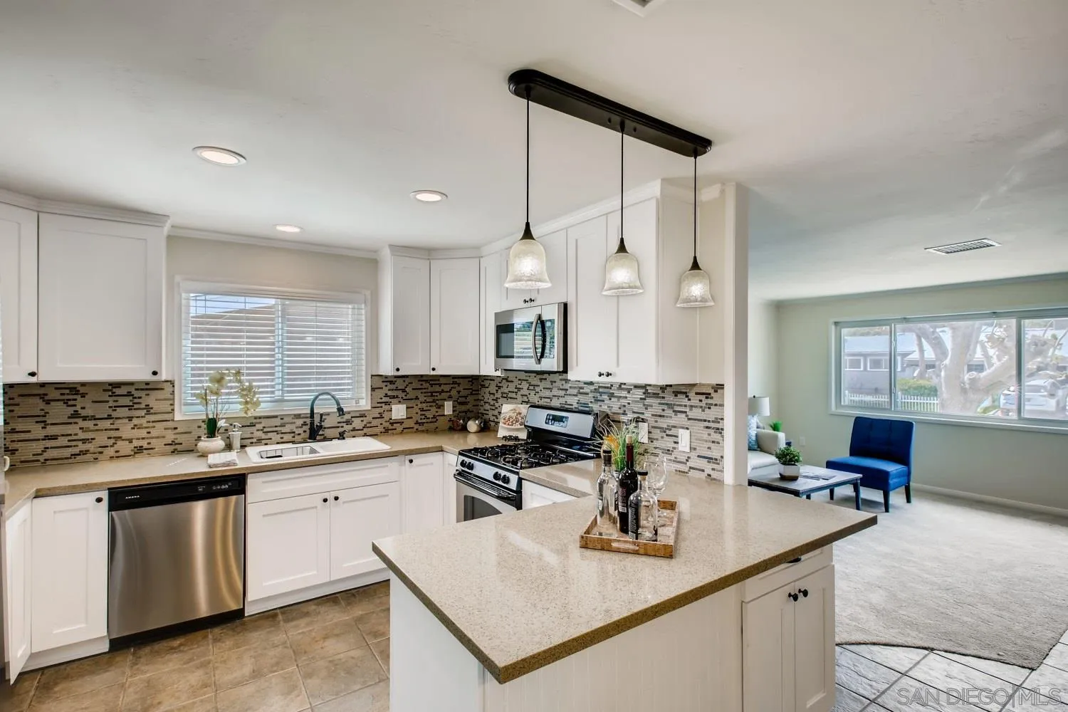 13639 Utopia Road Poway, CA 92064 - Photo 7 of 25 a kitchen with sink stove and cabinets