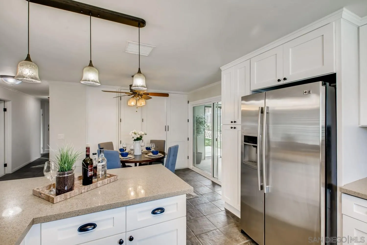 13639 Utopia Road Poway, CA 92064 - Photo 9 of 25 a kitchen with refrigerator a sink and cabinets