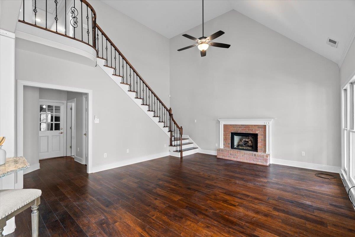 10440 Ansley Cove Collierville, TN 38017 - Photo 17 of 40 a view of an entryway with wooden floor fireplace and a window