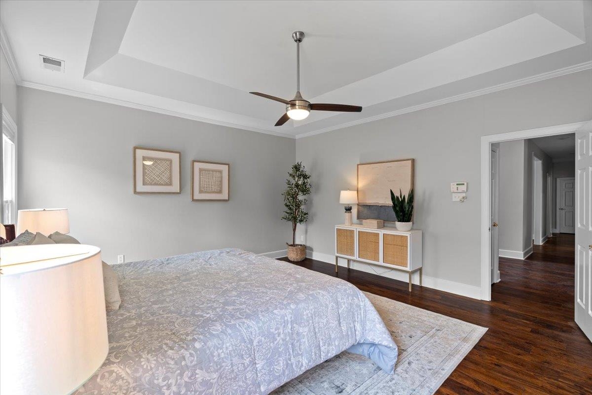 10440 Ansley Cove Collierville, TN 38017 - Photo 21 of 40 a bedroom with a bed and a flat tv screen on dresser