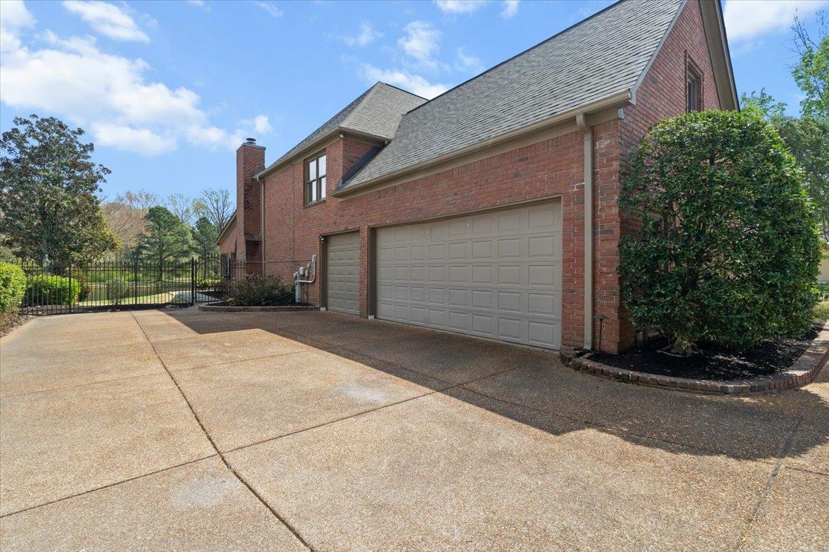 10440 Ansley Cove Collierville, TN 38017 - Photo 3 of 40 a house view with a outdoor space