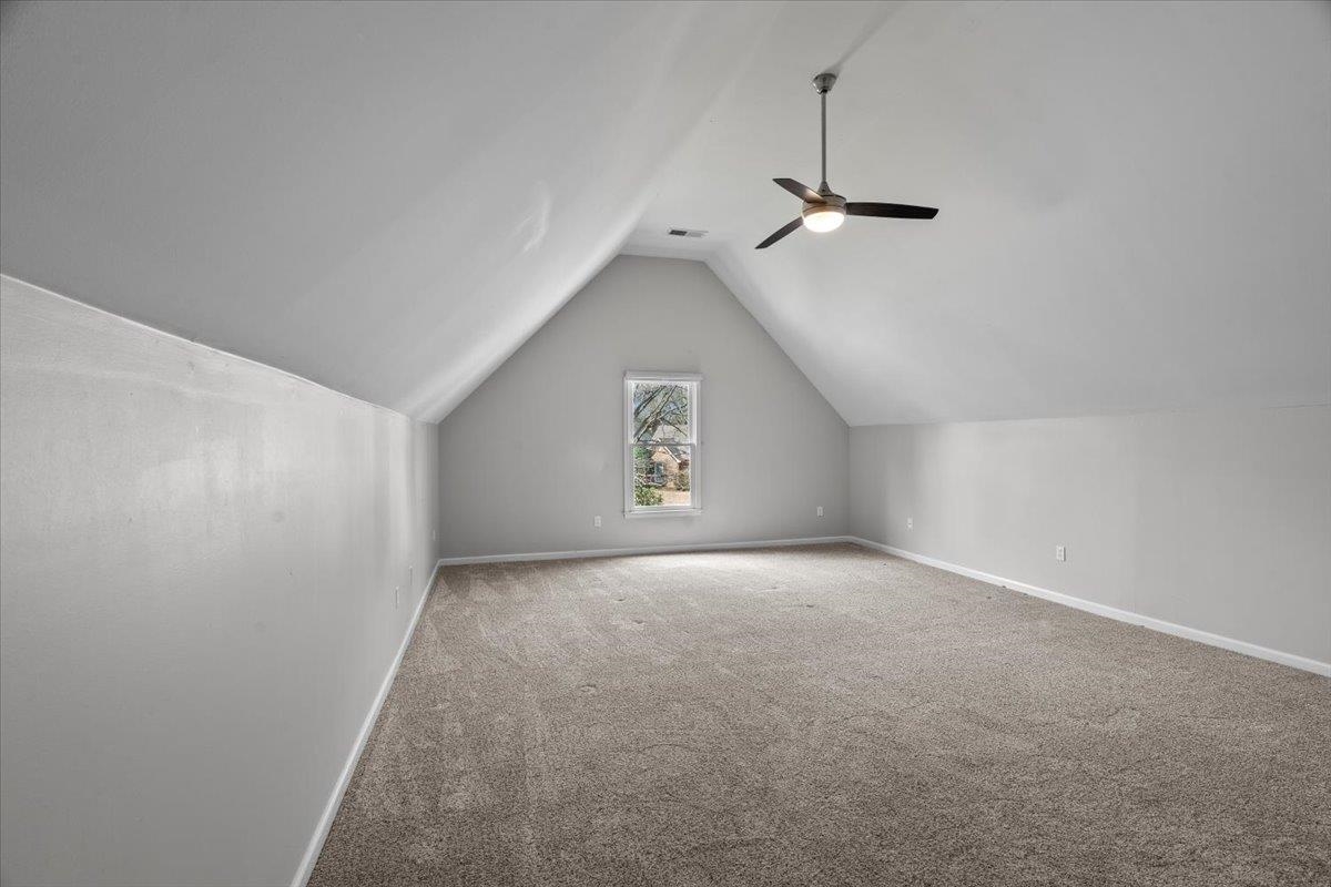 10440 Ansley Cove Collierville, TN 38017 - Photo 32 of 40 an empty room with a ceiling fan and a window