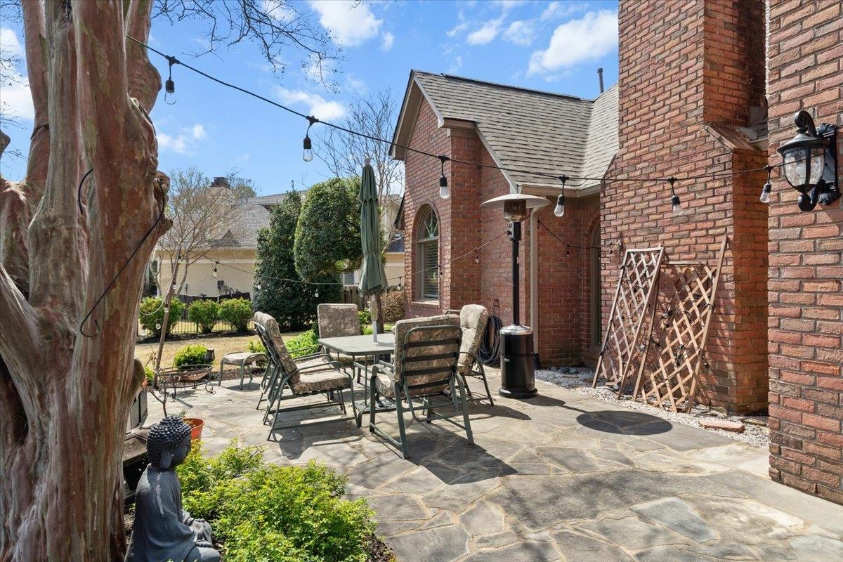 10440 Ansley Cove Collierville, TN 38017 - Photo 36 of 40 a view of a patio with table and chairs and potted plants