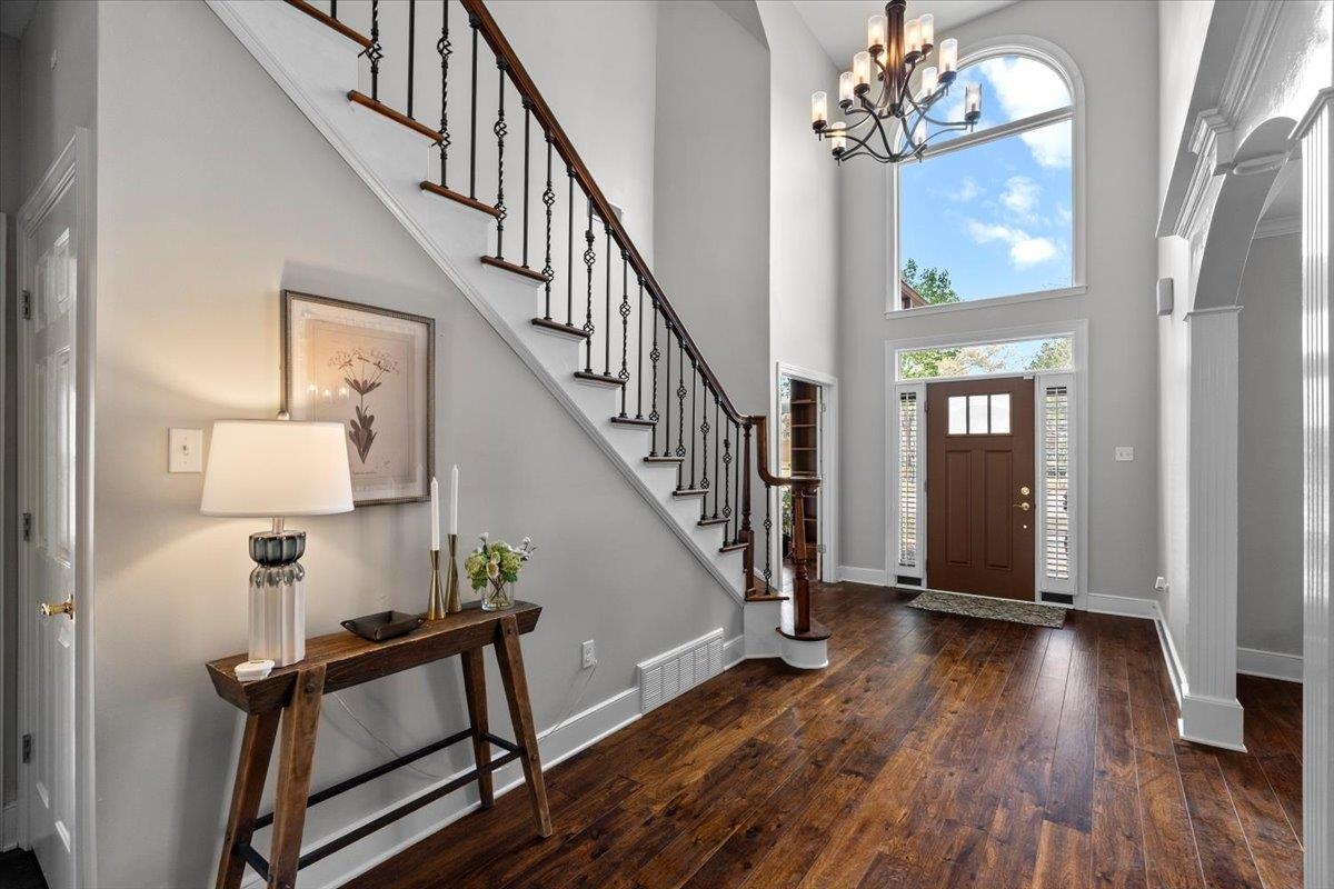 10440 Ansley Cove Collierville, TN 38017 - Photo 6 of 40 a view of an entryway wooden floor and chandelier