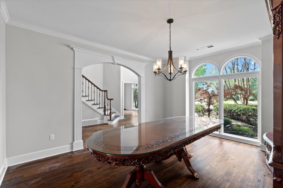 10440 Ansley Cove Collierville, TN 38017 - Photo 8 of 40 a view of a dining room with furniture window and wooden floor
