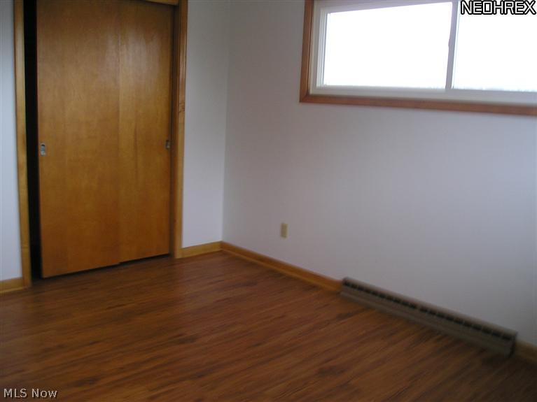 398 Herbert Road Akron, OH 44312 - Photo 18 of 25 Second Bedroom Showing Beautiful New Laminate Flooring & Natural Lighting from Window
