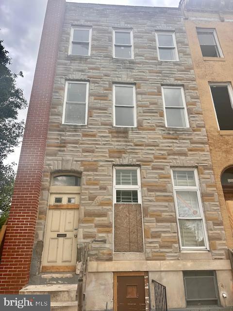 113 North Fulton Avenue Baltimore, MD 21223 - Photo 1 of 26 a brick building