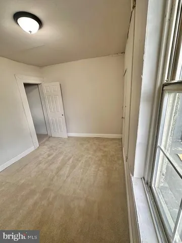 a bathroom with a toilet a sink and bathtub