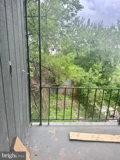 a view of a patio with a couple of chairs