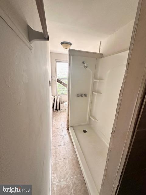 113 North Fulton Avenue Baltimore, MD 21223 - Photo 16 of 26 a bathroom with a glass shower door