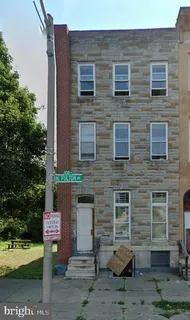 a front view of a building with garden