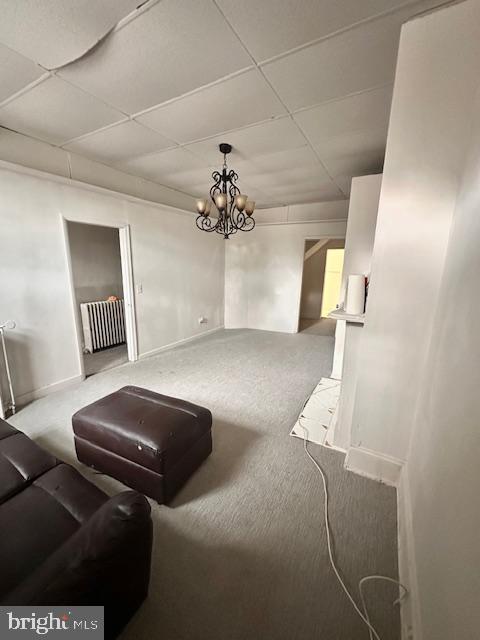 113 North Fulton Avenue Baltimore, MD 21223 - Photo 3 of 26 a bedroom with furniture and a chandelier