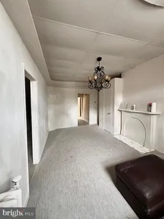 a view of a hallway to a bedroom