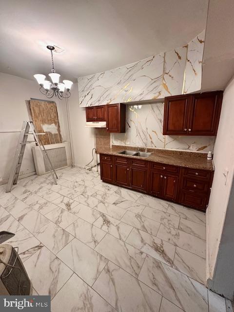 113 North Fulton Avenue Baltimore, MD 21223 - Photo 7 of 26 a kitchen with stainless steel appliances a sink and a refrigerator
