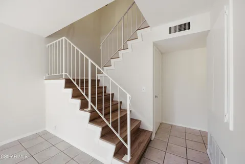 a view of a hallway with staircase