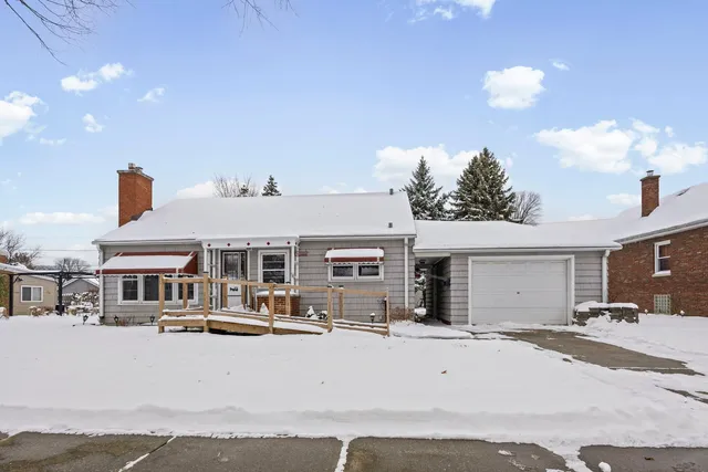 a view of a house with roof and sitting area