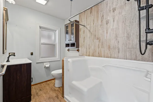 a kitchen with stainless steel appliances granite countertop a sink and cabinets