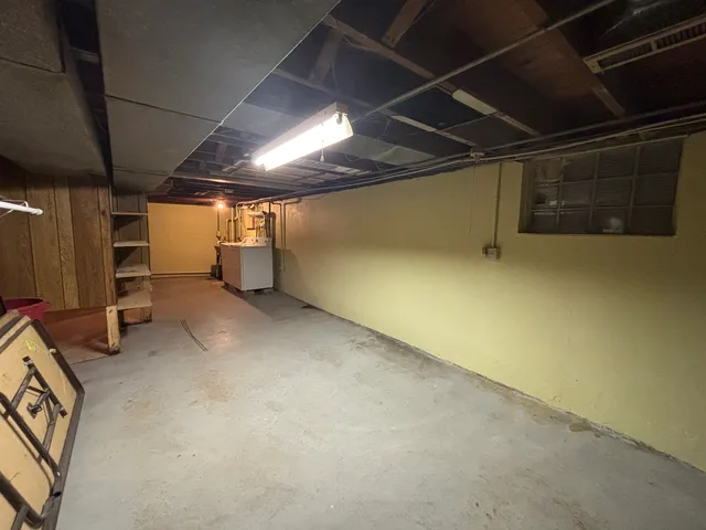 a view of storage and utility room with stairs