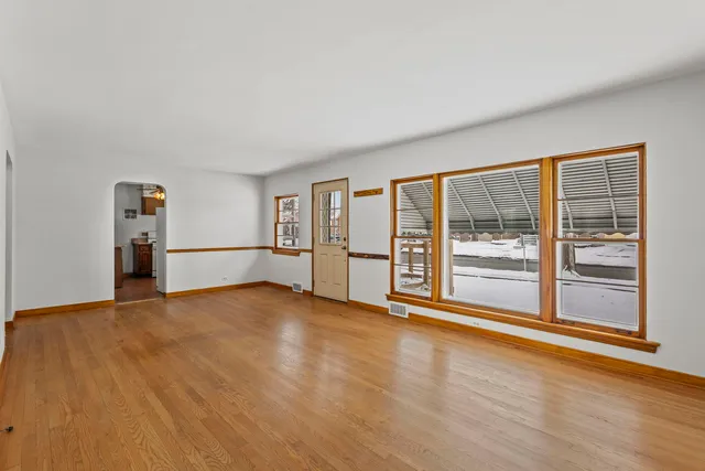a view of an empty room with glass door