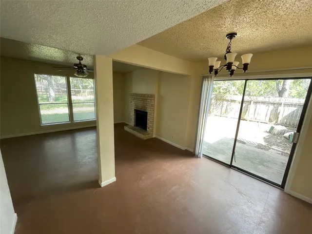 wooden floor in an empty room with a fireplace