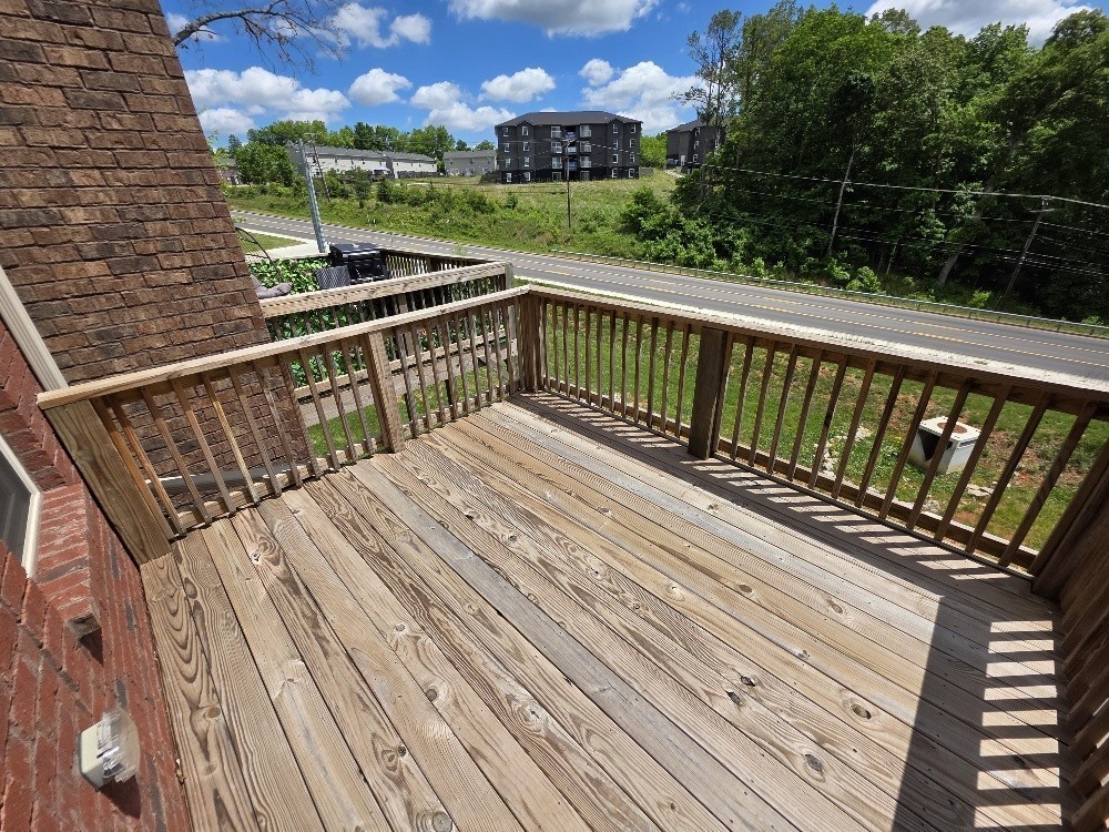 550 Peachers Mill Road, Unit A2 Clarksville, TN 37042 - Photo 14 of 15 a view of balcony with wooden floor and fence
