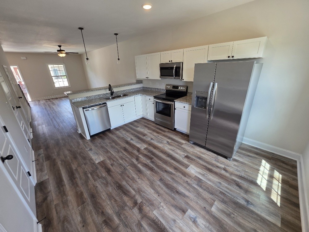 550 Peachers Mill Road, Unit A2 Clarksville, TN 37042 - Photo 3 of 15 a kitchen with stainless steel appliances a refrigerator sink and microwave