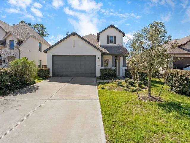 a front view of a house with yard and seating area