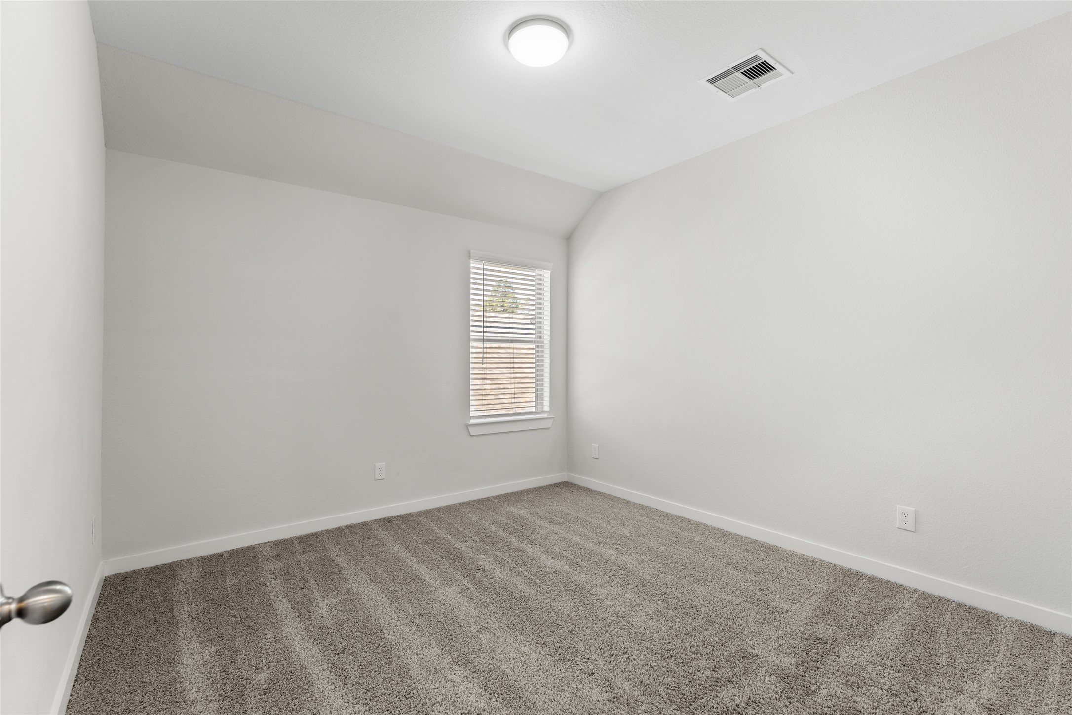 439 Flowering Lotus Court Conroe, TX 77318 - Photo 23 of 33 an empty room with a window